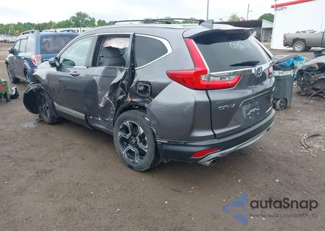 2018 Honda Cr-V Touring z USA, uszkodzony, nr VIN 7FARW2H90JE018638